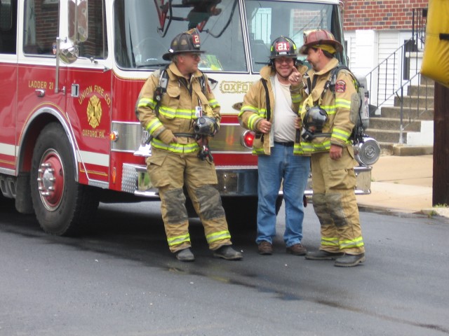 Firefighter Mike Evosirch, Past Chief Jim Prettyman, and Firefighter Mike Nelson with Ladder 21.